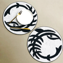Load image into Gallery viewer, Two Beaded Black White Round Abstract Placemats with white plate and gold Fork and Knife
