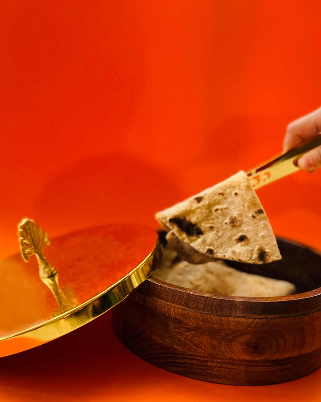 Wooden Chapati Box with  Gold Peacock  Lid and tongs holding chapati