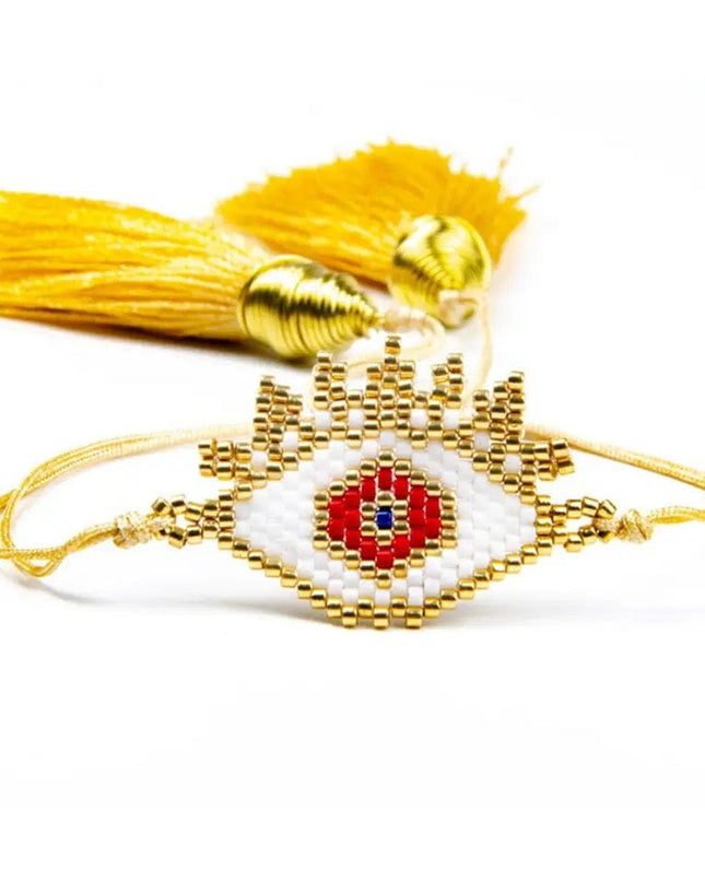 Gold Beaded Bracelet with White and Red Evil Eye